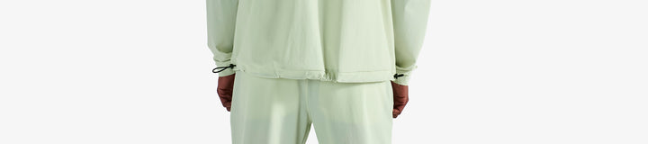 PERFORMANCE QUARTER ZIP SHELL PULLOVER