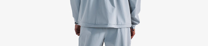 PERFORMANCE QUARTER ZIP SHELL PULLOVER