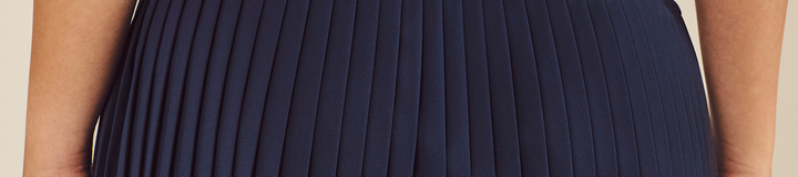 STUDIO SEOUL WRAP PLEATED SKIRT