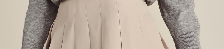 STUDIO SEOUL HIGH-LOW PLEATED SKIRT