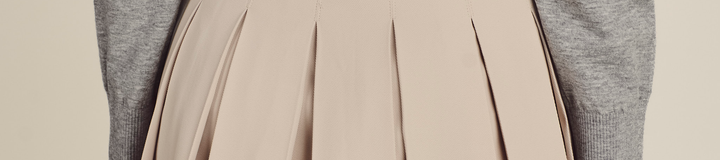 STUDIO SEOUL HIGH-LOW PLEATED SKIRT