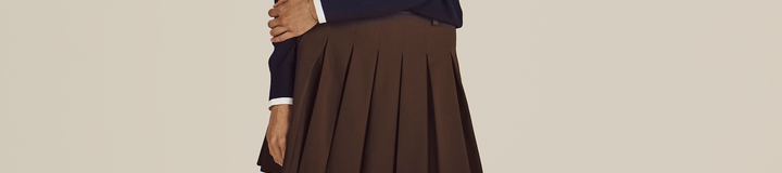 STUDIO SEOUL HIGH-LOW PLEATED SKIRT