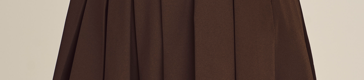 STUDIO SEOUL HIGH-LOW PLEATED SKIRT