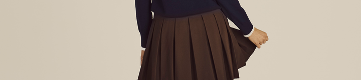 STUDIO SEOUL HIGH-LOW PLEATED SKIRT