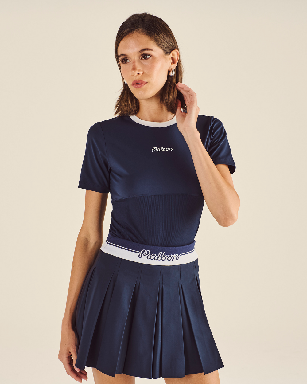 STUDIO SEOUL LOGO BANDING PLEATED SKIRT
