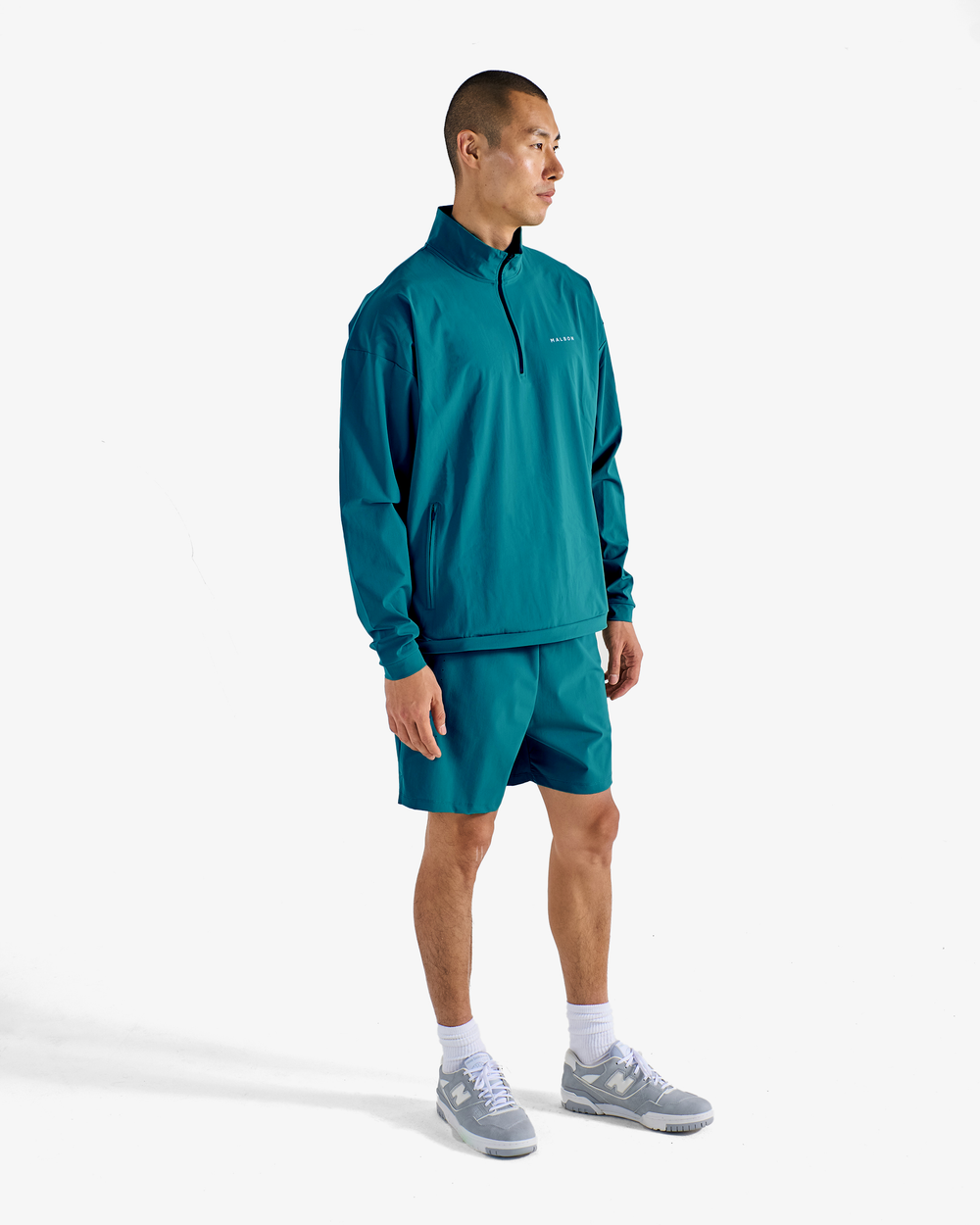 PERFORMANCE QUARTER ZIP SHELL PULLOVER