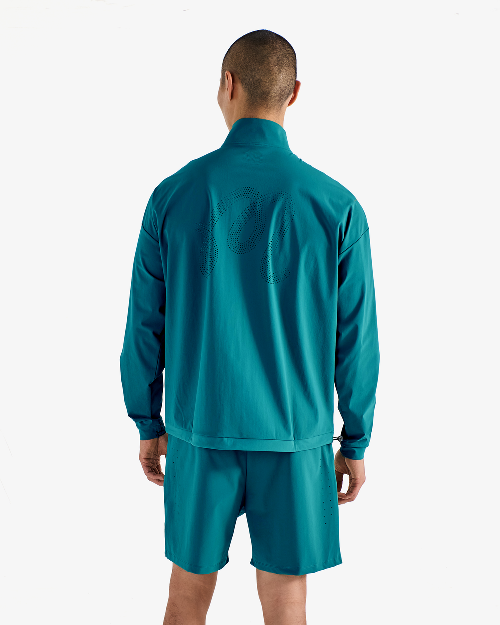 PERFORMANCE QUARTER ZIP SHELL PULLOVER