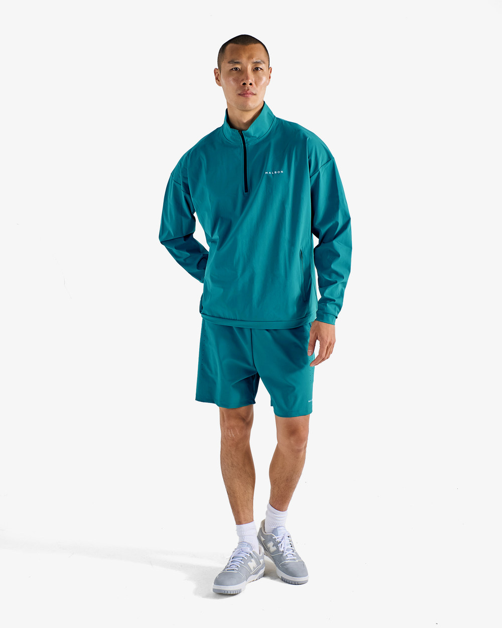 PERFORMANCE QUARTER ZIP SHELL PULLOVER