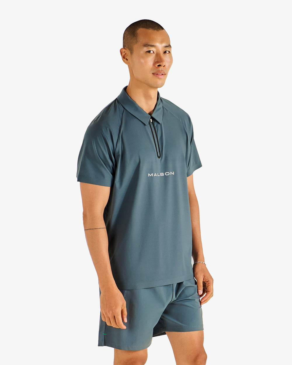 PERFORMANCE ZIP RAGLAN POLO