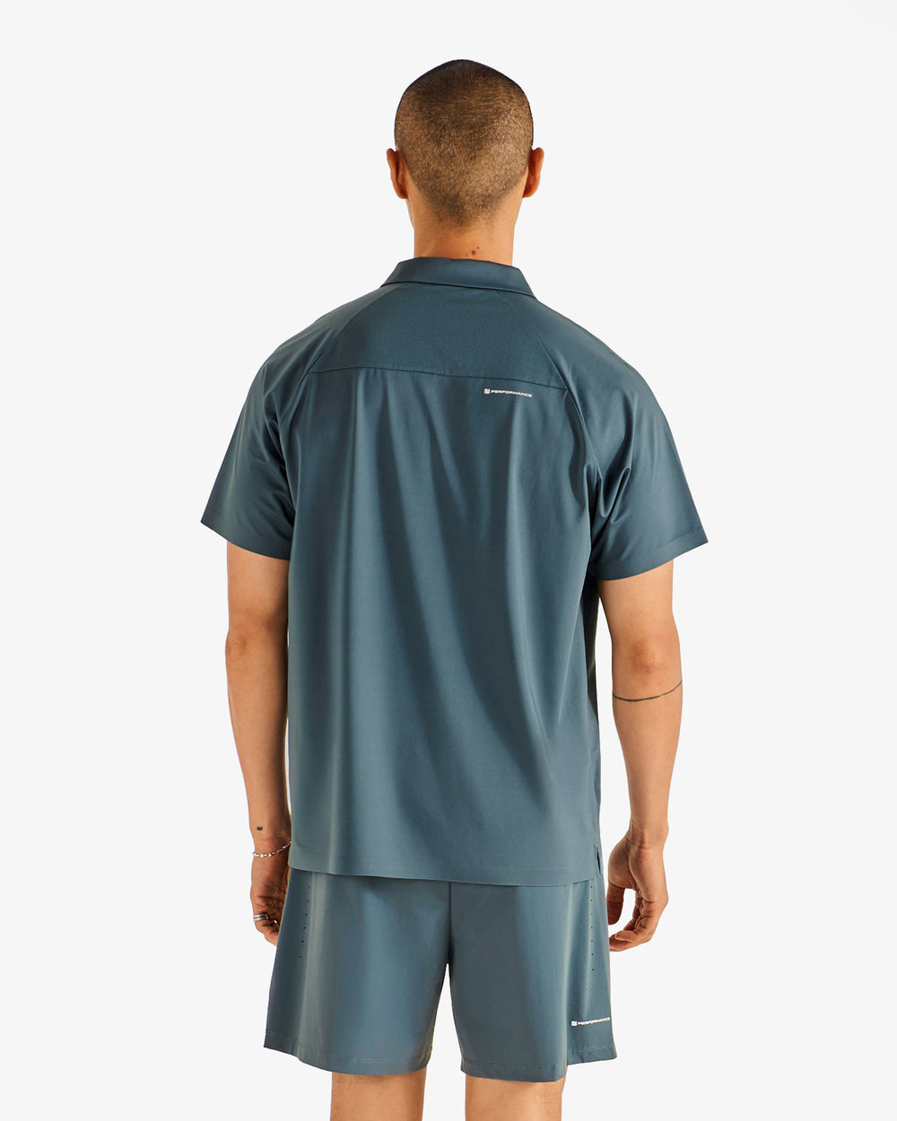 PERFORMANCE ZIP RAGLAN POLO