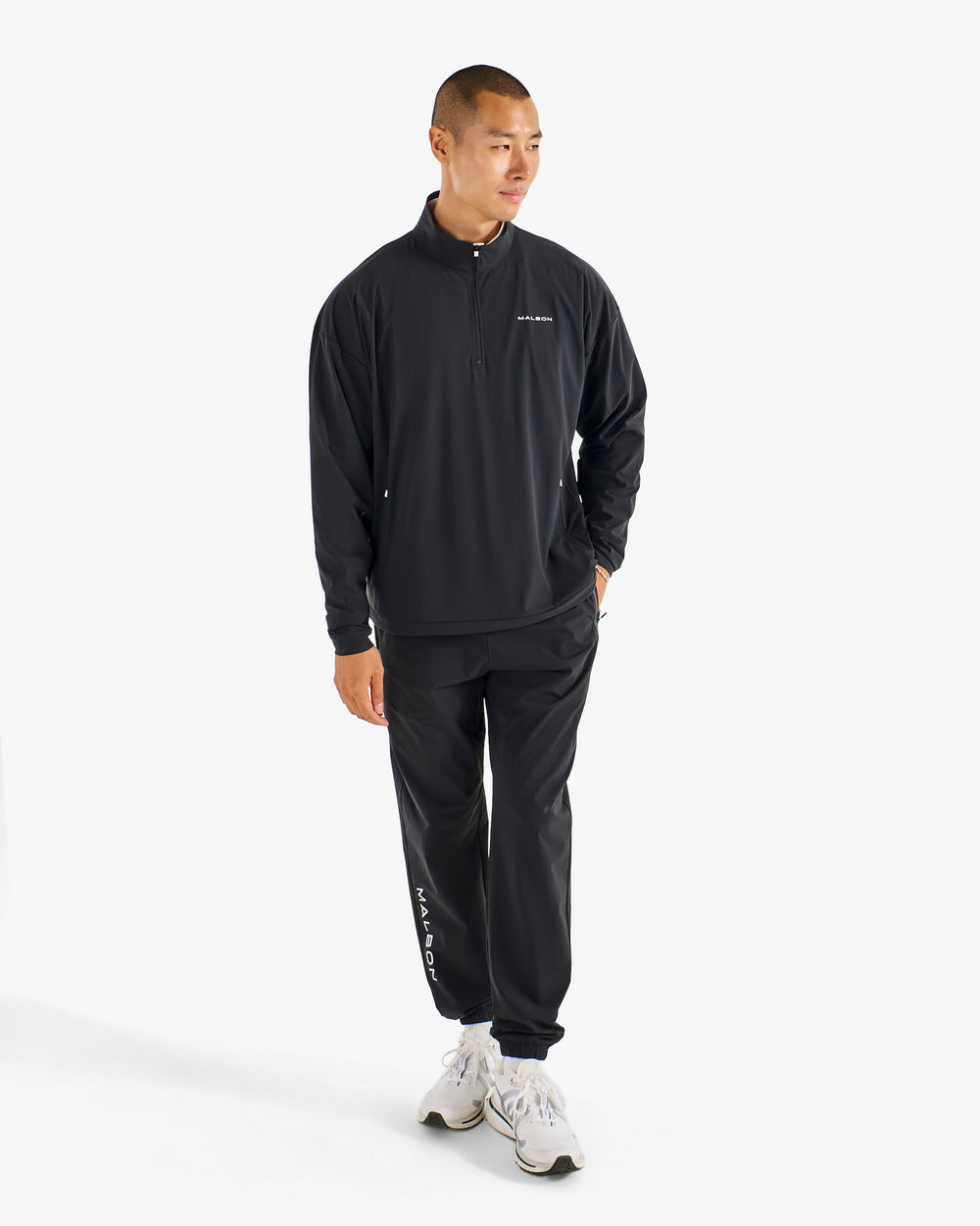 PERFORMANCE QUARTER ZIP SHELL PULLOVER