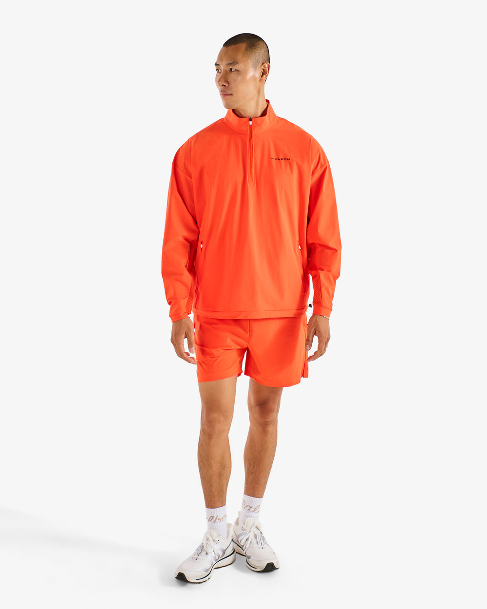 PERFORMANCE QUARTER ZIP SHELL PULLOVER