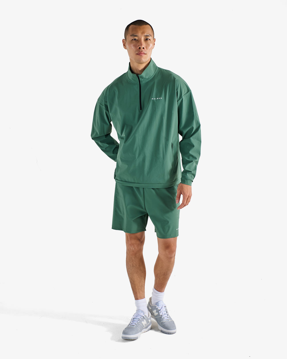 PERFORMANCE QUARTER ZIP SHELL PULLOVER