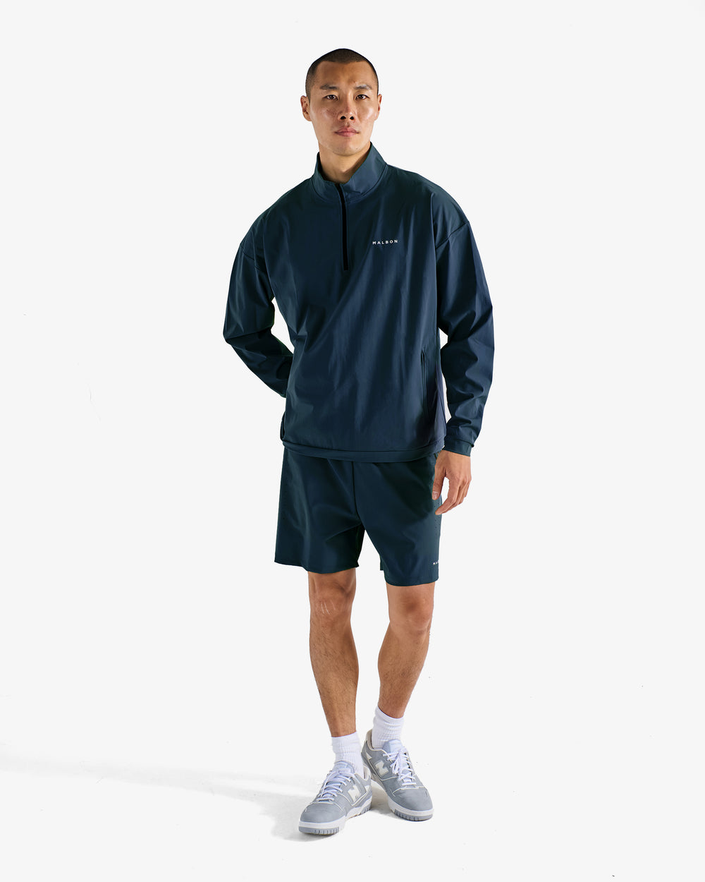 PERFORMANCE QUARTER ZIP SHELL PULLOVER