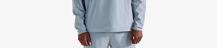 PERFORMANCE QUARTER ZIP SHELL PULLOVER