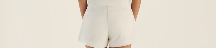 GEMMA ZIP SLEEVELES POLO